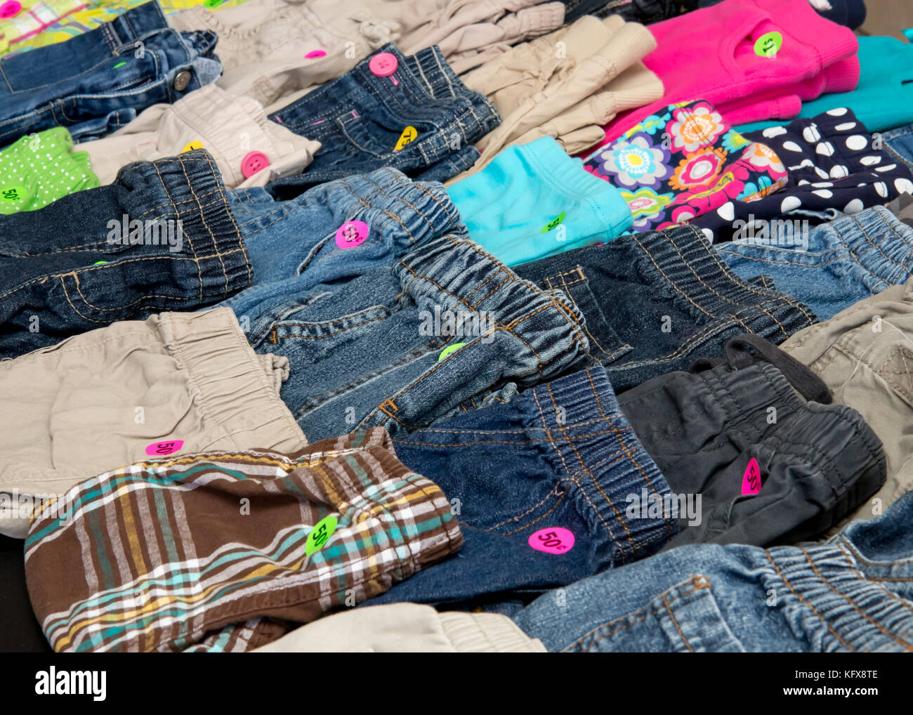 Children`s pants on display at a suburban garage sale Stock Photo